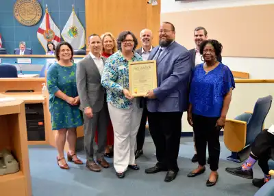 Board Member Kathy Burstein, Board Chair Trey Fogg, Board Member Melissa Nash, President Claudia Kirk Barto, Board Member Rob Anderson, Commissioner Barnett, Board Member Tom Pinckney and Board Member Dr. Mary Ann DuPont